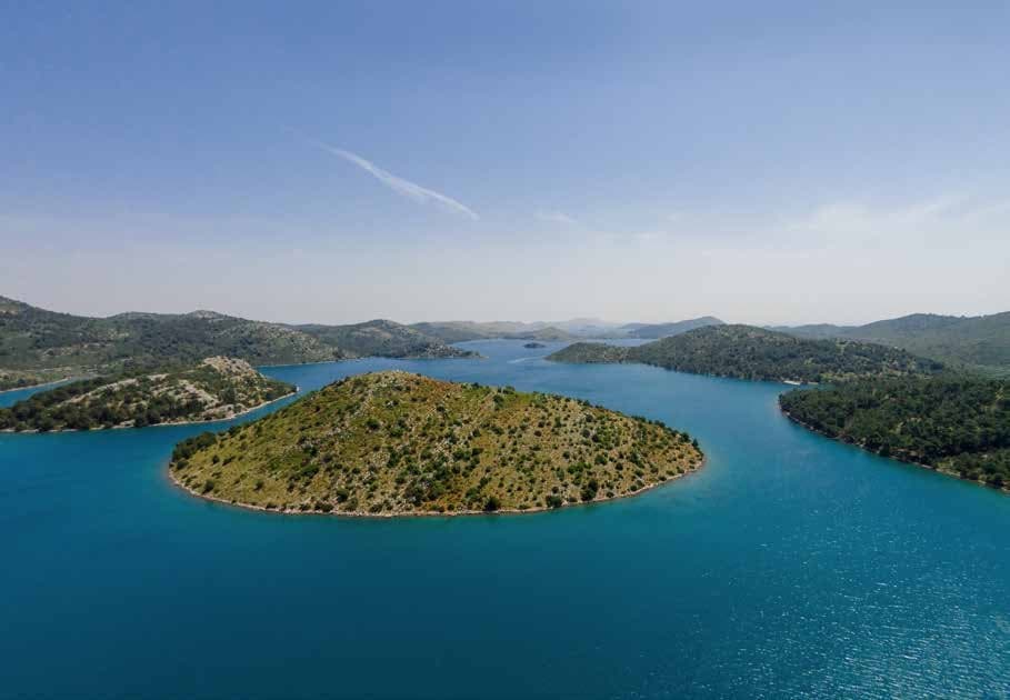 Islets scattered offshore from the estate's southern headland on Dugi Otok.